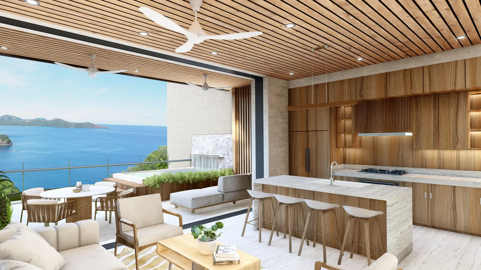 3D rendering of the spacious interior of Corner House, featuring a kitchen and living room with stone countertops, wooden cabinets, and a white sofa. The room has a wooden ceiling with ceiling fans, large windows overlooking the blue sea and mountains, and a terrace with furniture and plants.